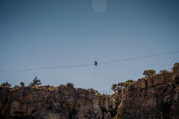 Acrobatics on a tightrope over a crater 55meters high at Lavrio, Greece
