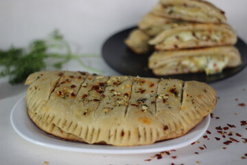 Home baked garlic bread filled with mozzarella cheese.