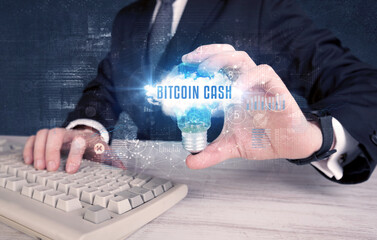 Businessman holding a light bulb, business concept