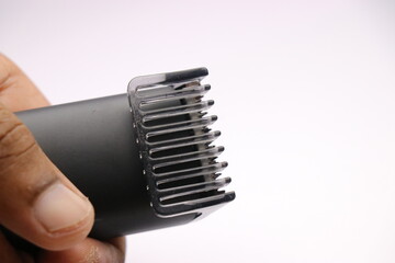 Fototapeta na wymiar Beard trimmer closeup of trimmer blades with clip
