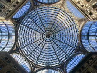 Old historic shopping arcade with glas dome in Naples, Italy