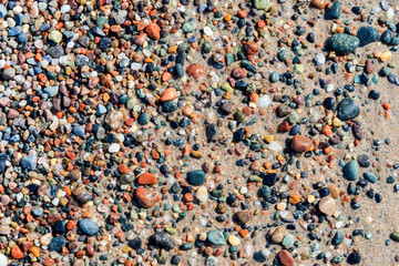 Beautiful colorful beach pebbles and sand