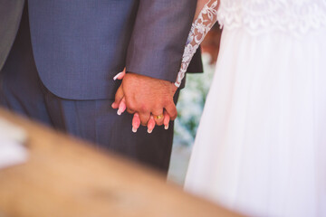 bride and groom holding hands