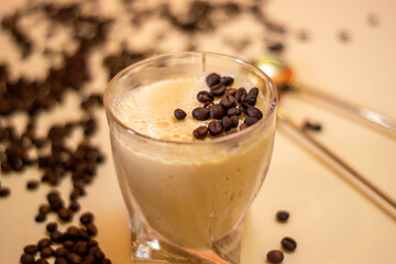 on a light background dessert coffee mousse and coffee grains