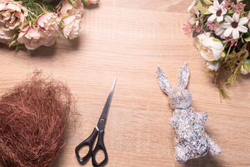 DIY instructions for creating an Easter decoration in the shape of a hare. Step 3 glue the body of the foil bunny with a glue gun.