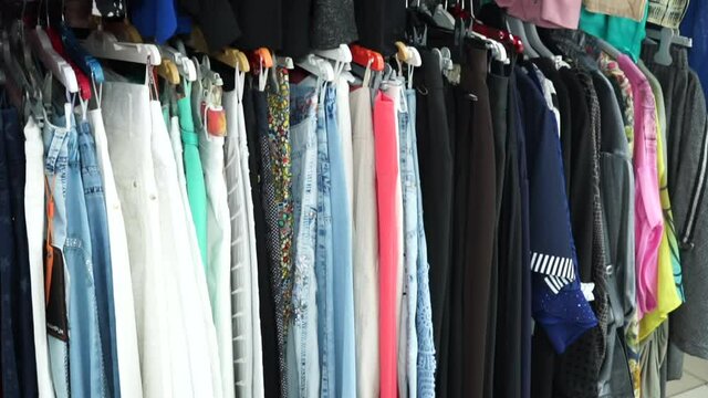 A variety of women's clothing. Women's dresses and jeans