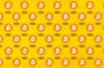 Bitcoin pattern on yellow background. Cryptocurrency concept wallpaper