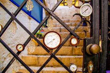 Tel Aviv-Jaffo, Israel - March 15, 2021: fragment of The atmospheric door with clocks and sensors in the old city of Jaffa in Israel