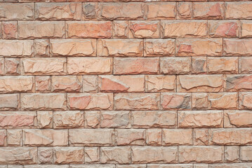 Plaster on a yellow wall. Concrete wall texture close up.
