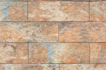 Plaster on a yellow wall. Concrete wall texture close up.