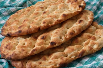 Three Ramadan pitas. (Turkish name is Ramazan Pidesi.) Traditional Turkish bread consumed only during Ramadan.