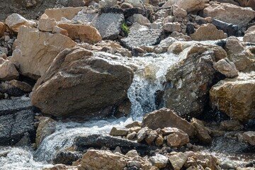 small stream of meltwater in a remote mountain region in Lebanon