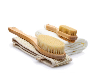 A set of items from natural materials for body care isolated on a white background. Dry massage brush, washcloth, pumice stone. Self-care concept