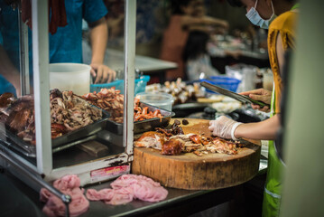 A shop selling chicken rice, pork rice, in Chumphon, Thailand.