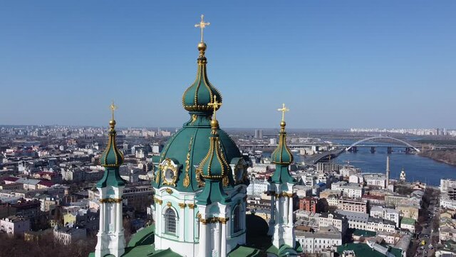 View of the roof of the St. Andrew's Church in Kyiv, Ukraine on the historical downtown background