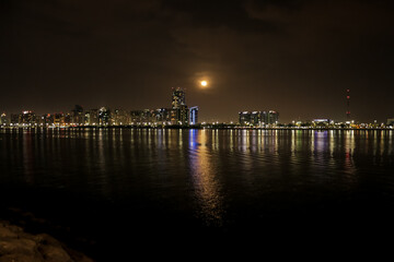 view of the city skyline at night, Abu Dhabi