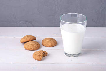 still life of a modest breakfast of oatmeal cookies and a glass of yogurt
