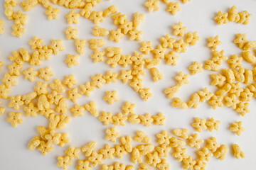 Breakfast cereal pattern. A lot of small stars on white background. Top view. 