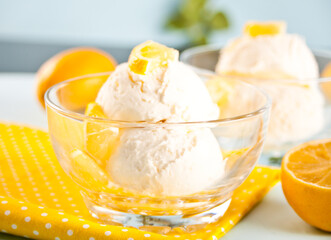 Homemade fresh lemon ice cream with lemon slices. Summer dessert.
