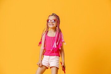 Beautiful European girl with dreadlocks. Mobile phone in the han