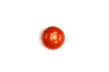 Tomato without a stalk with water droplets. Isolated on white.