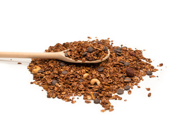 Chocolate granola cereal with nuts in a wooden spoon.