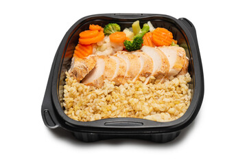 Ready food in a container. Stewed chicken, stewed carrot, cabbage and porridge.