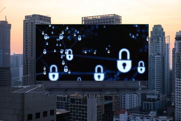 Padlock icon hologram on road billboard over panorama city view of Bangkok at sunset to protect business, Southeast Asia. The concept of information security shields.