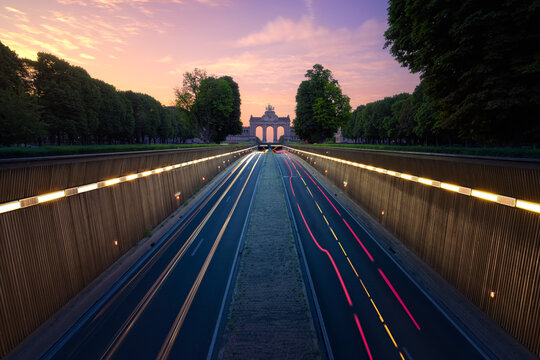 Triumphal Arch and Belliard Tunnel in the Cinquantenaire (50th anniversary) Park at the sunrise. Brussels. Belgium