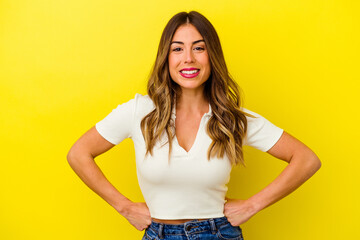 Young caucasian woman isolated on yellow background