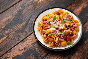 Conchiglie alla Amatriciana pasta with pancetta bacon, tomatoes and pecorino cheese. Healthy Italian food