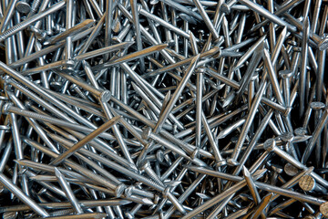 Pointed metal with flat rounded head for fastening other objects tightly. There are different types used by the type of work, so called nails.