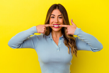 Fototapeta premium Young caucasian woman isolated on yellow background