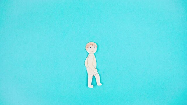 4k Small drawn human child walks or runs quickly isolated on light blue background. Baby stop motion handmade animation. Happy childhood concept. Cartoon. Copy space. Template for design.