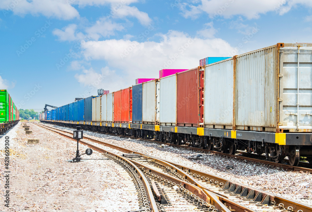 Wall mural freight train carrying containers at inland container depot station