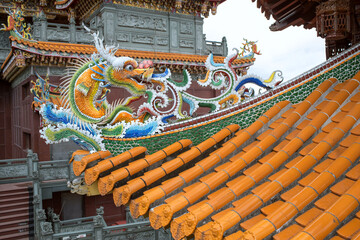 Fototapeta na wymiar Dragon statue at Guandu Temple in Taipei, Taiwan　台北の寺院 關渡宮の龍の屋根飾り