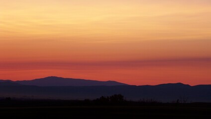 Montana sunset  behind the hills and forest