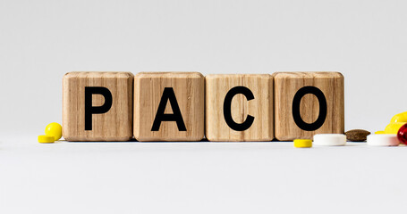 cubes with the word PACO on them. Care concept.