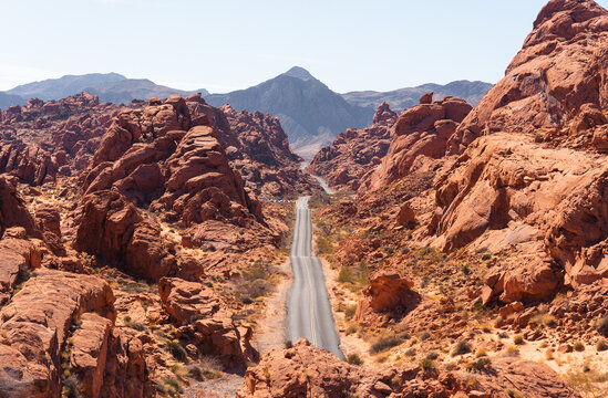 Road surrounded by rock formations under the sunlight in Rainbow Vista, Nevada, the USA
