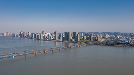 Fototapeta na wymiar Aerial view of Qiantang River Bridge and modern city skyline in Hangzhou, China