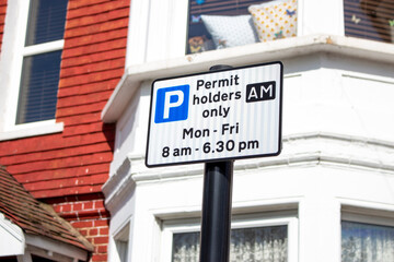 sign saying Permit holders only: Mon - Sun, 8am - 6:30pm