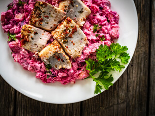 Marinated herring fillets in cream with roast beetroots, pickled cucumber, boiled potatoes,...