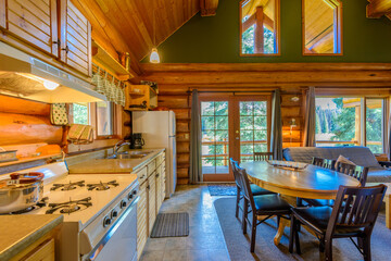 Modern dining room in log cabin or luxury house.
