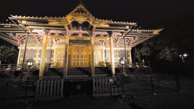 tokyo, japan - november 05 2020: Pan video wide view of the golden Ueno Tosho-gu shrine dedicated to the Shogun Tokugawa Ieyasu and classed as Important cultural property at night.