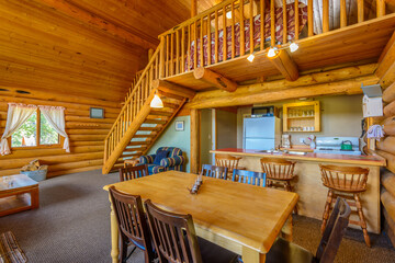 Modern dining room in log cabin or luxury house.