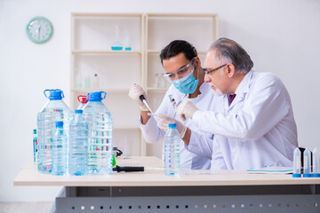 Two chemists working in the lab