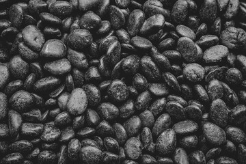 Pebble stones. Black pebble stones texture background for Zen concept.