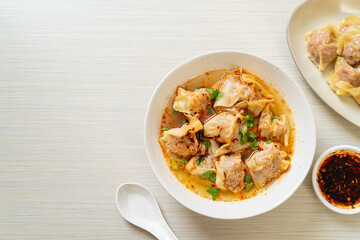 pork wonton soup or pork dumplings soup with roasted chili