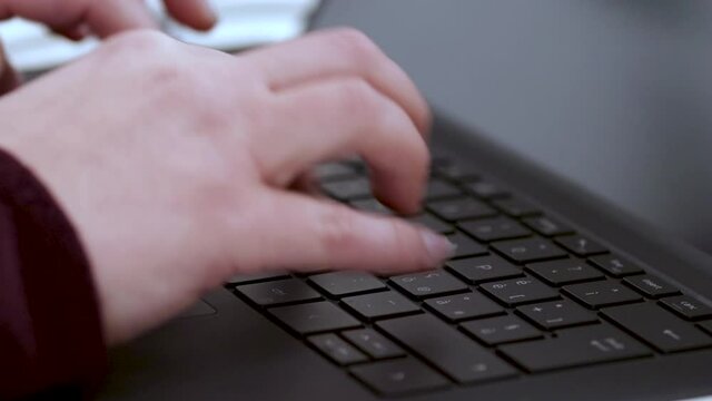 Typing keyboard laptop, developer at work building software. Hands typing on notebook keyboard.