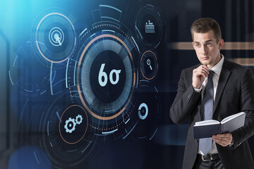 Handsome businessman holding a planner with his notes and ponder